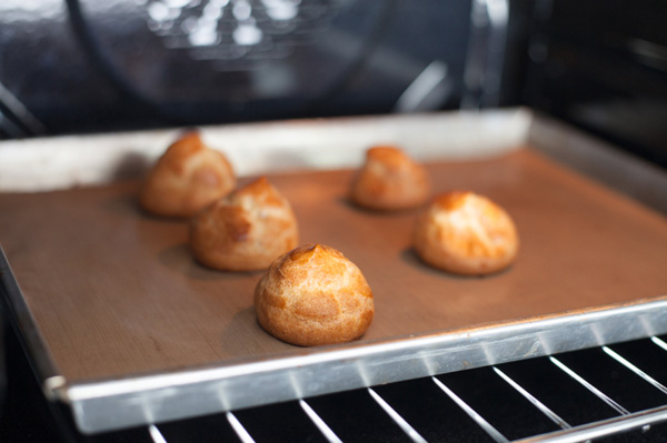 Cream puffs in oven