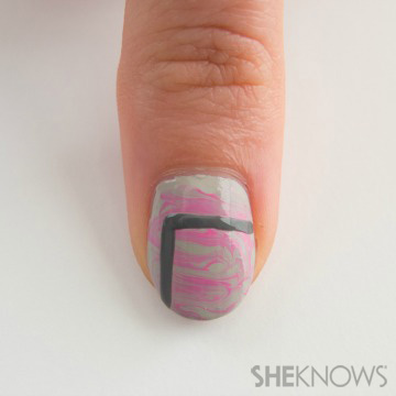 A nail design outlined in stitches