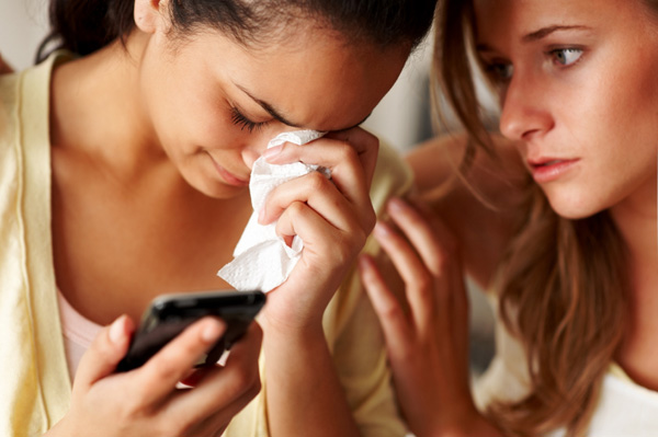 Woman crying over text message