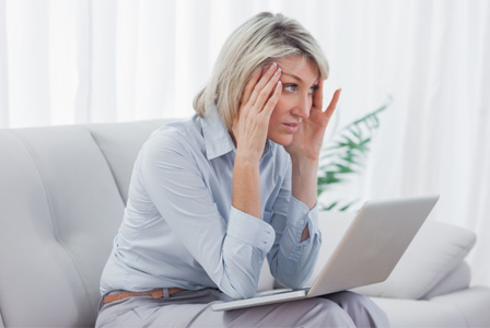 Worried woman on computer