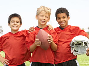 Boys playing football | Sheknows.com