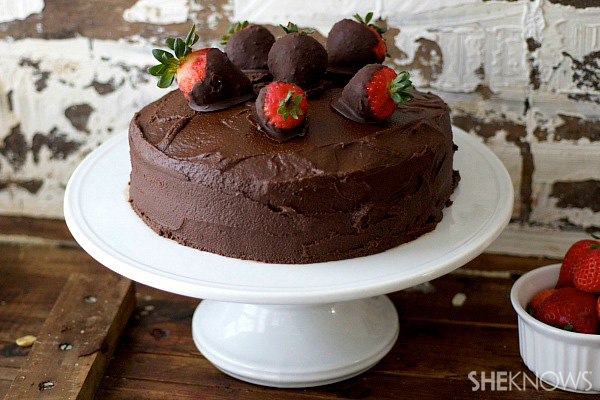Strawberry cake with brownie frosting and chocolate covered strawberries