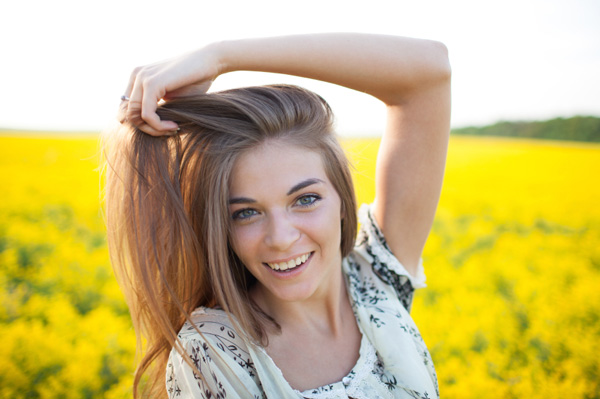 Woman with great hair standing in field
