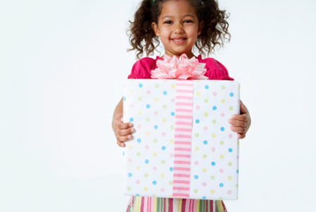 Girl with birthday present | Sheknows.com