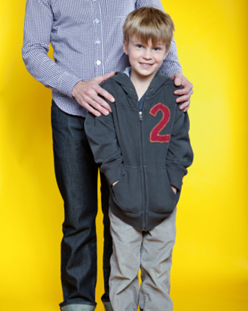 Father standing behind son | Sheknows.com