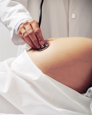 Pregnant woman getting examined by doctor | Sheknows.com