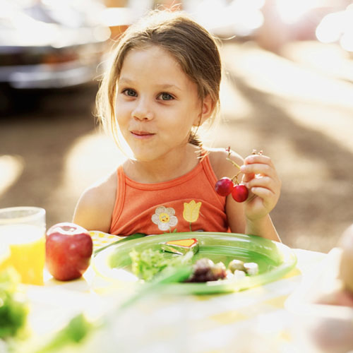 Little girl eating snack