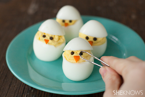 Place the top slice of egg white on each chick, and add two 