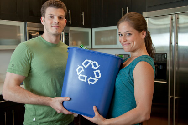 On trash day couple recycling