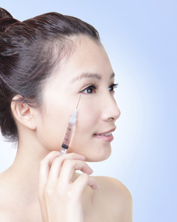 Woman injecting botox