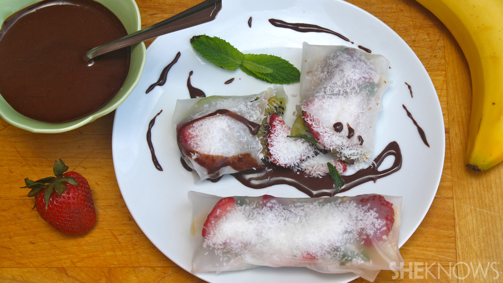 Vegan strawberry, banana & almond spring rolls with chocolate sauce