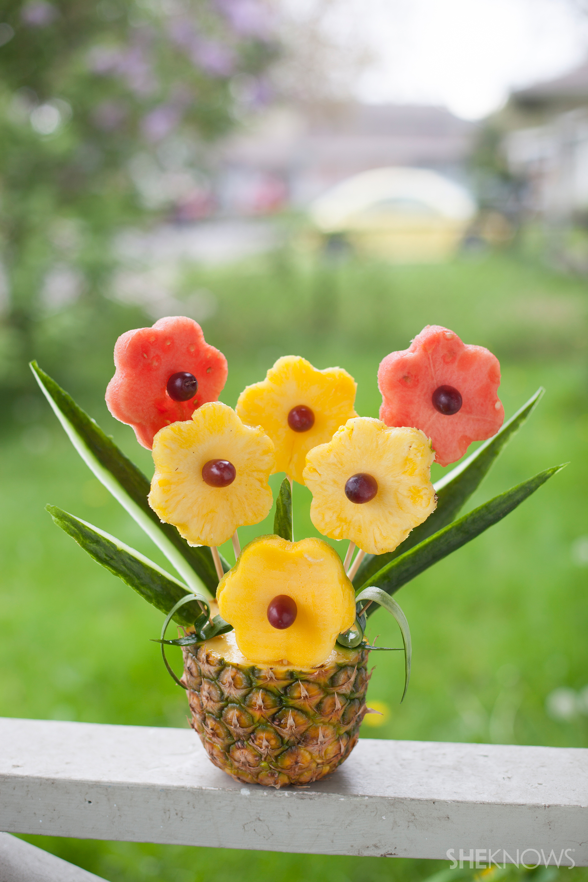 Tropical fruit bouquet in a pineapple vase