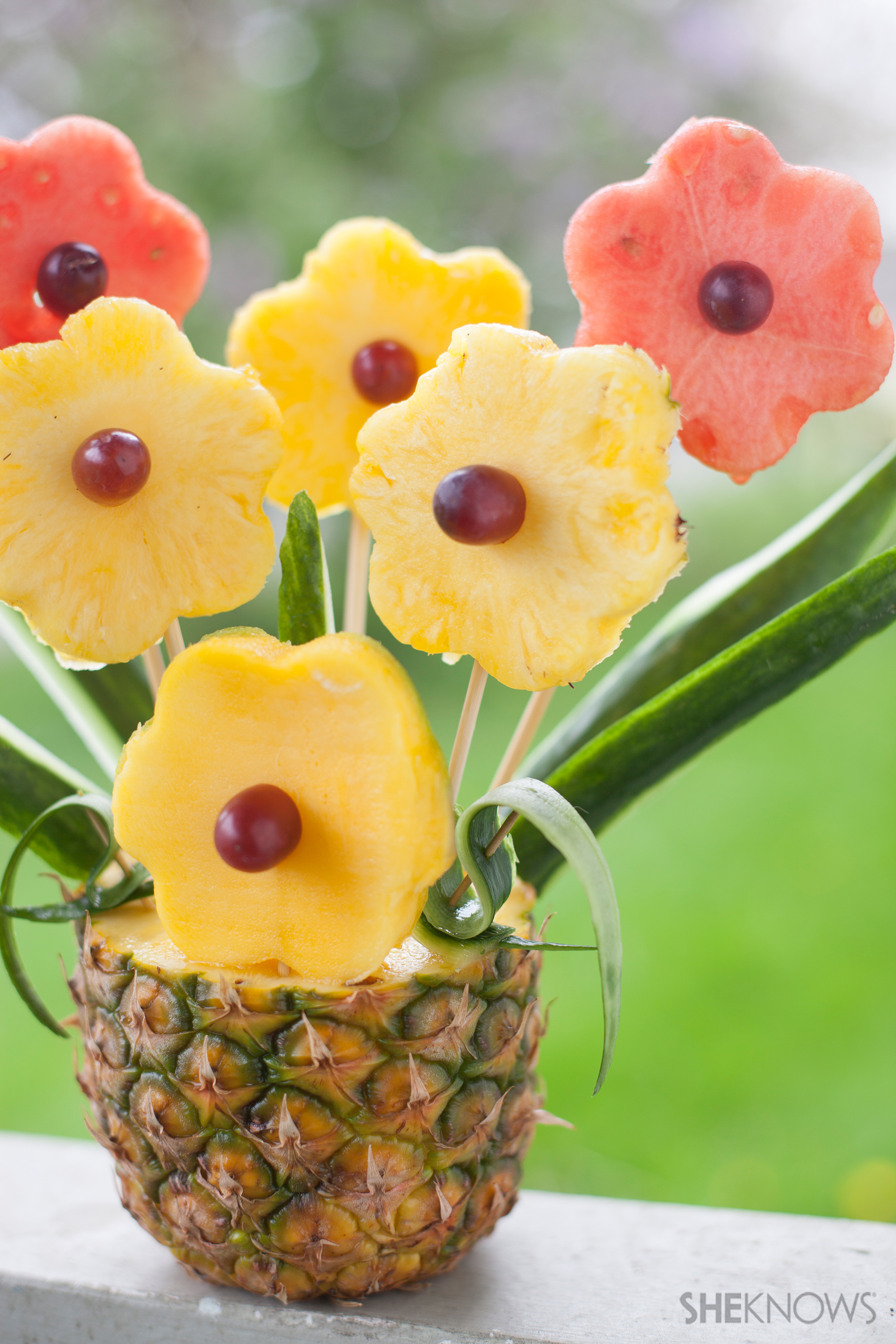 Tropical fruit bouquet in a pineapple vase