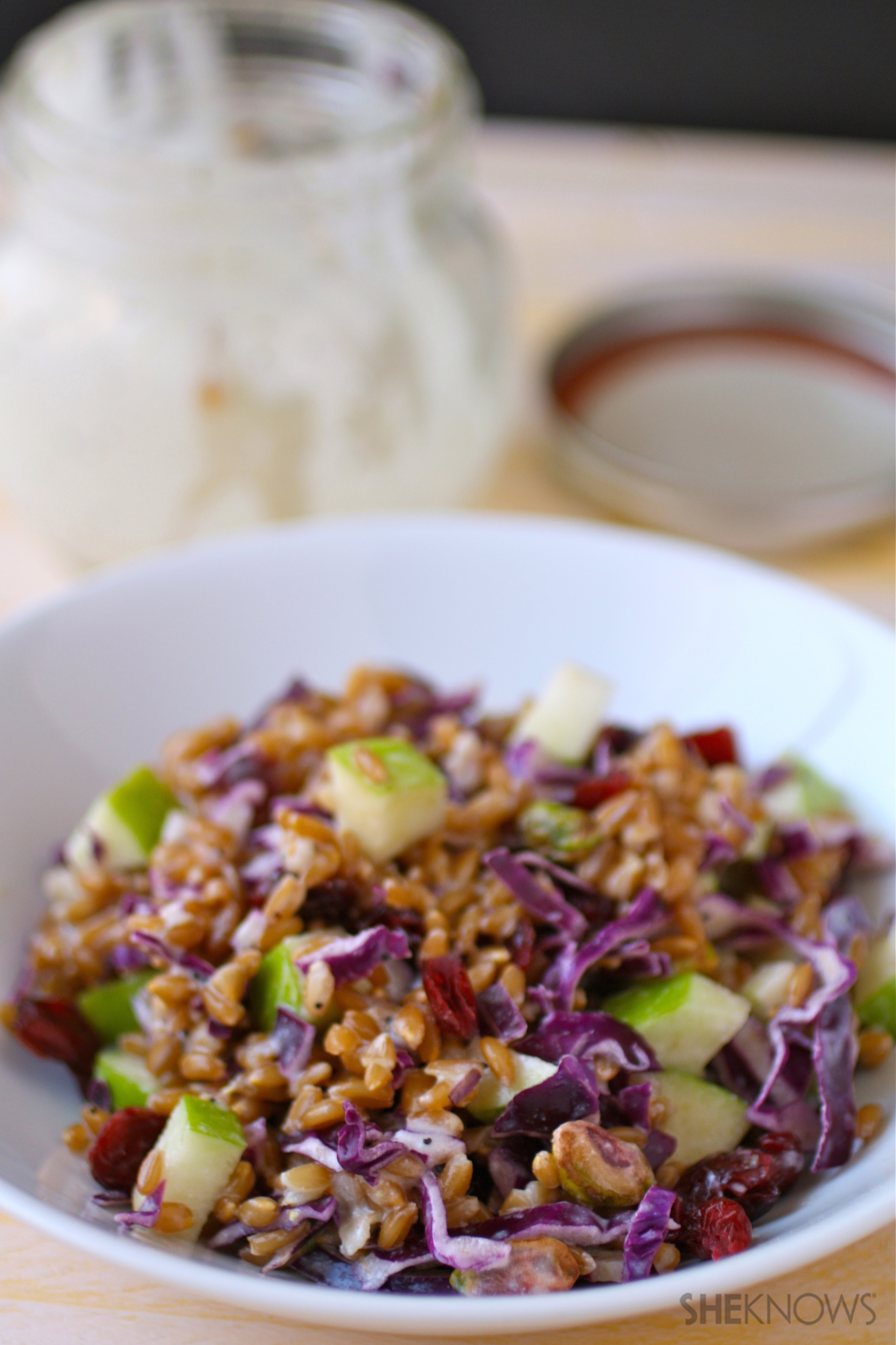 Mason jar salad with farro, cabbage and apples and poppy seed dressing