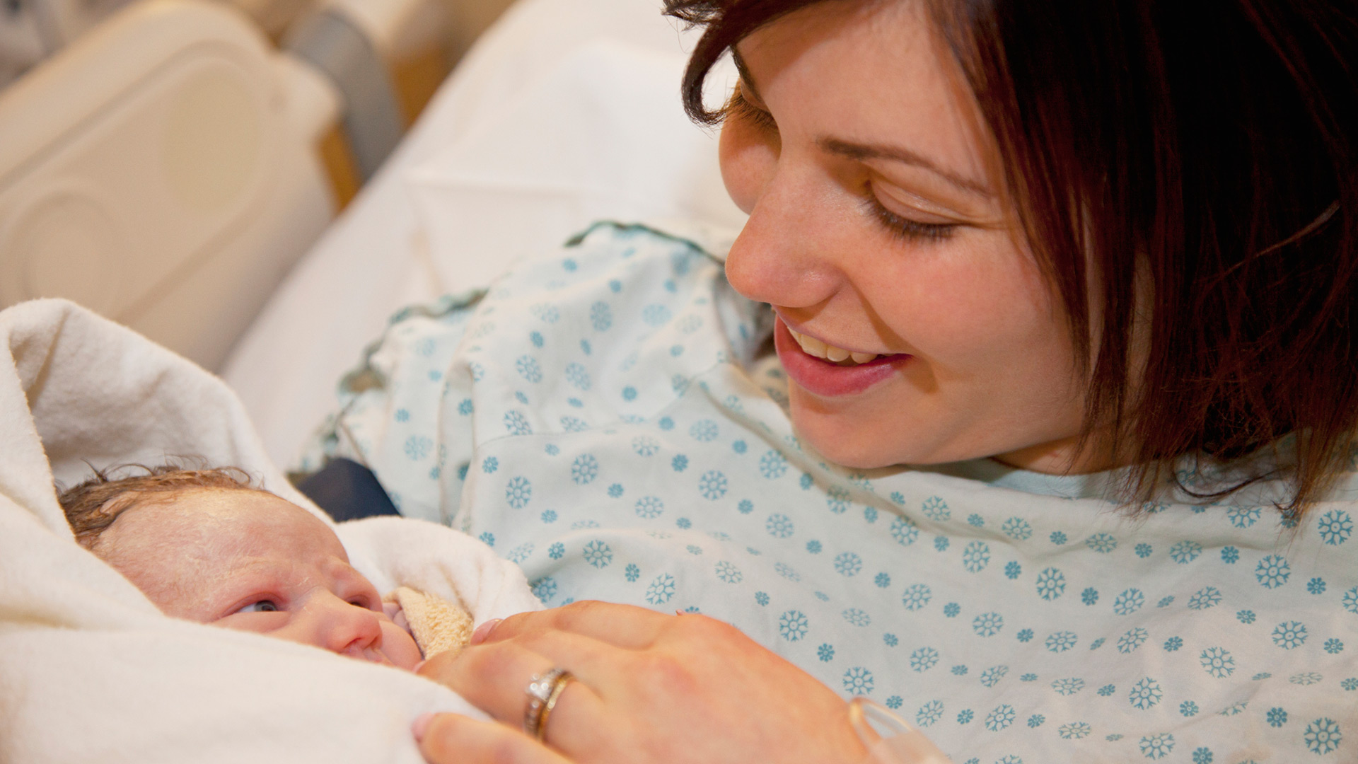 woman in hospital with newborn