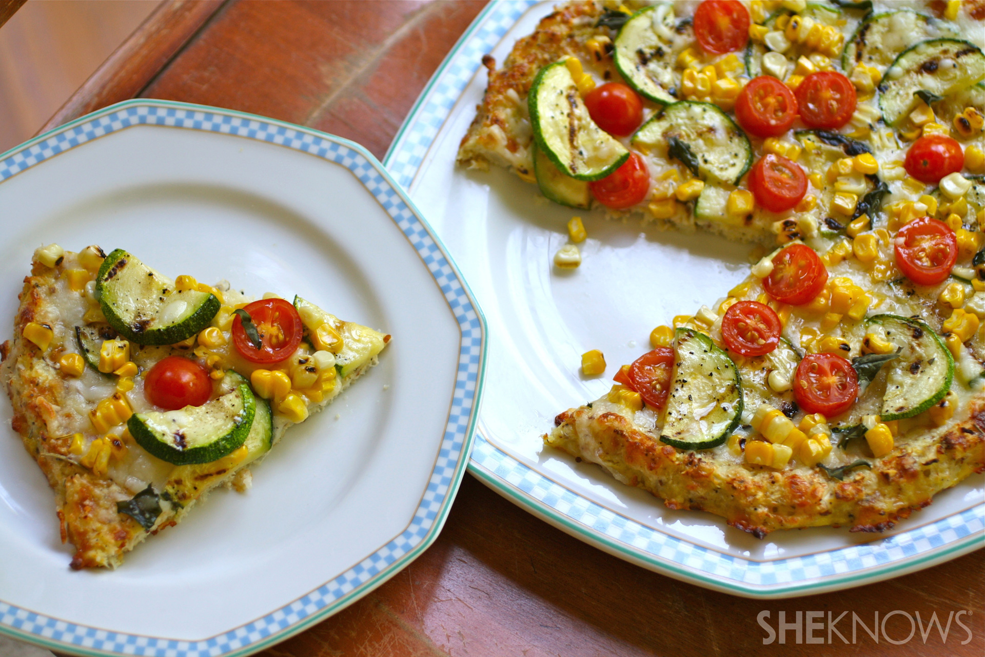 Cauliflower crust pizza with grilled corn, zucchini, and tomatoes