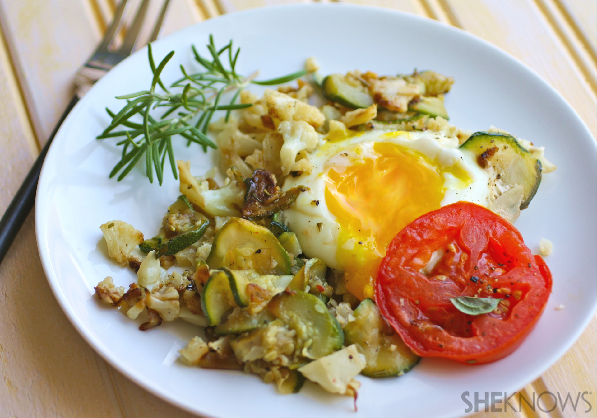 Skillet cauliflower and zucchini hash with eggs