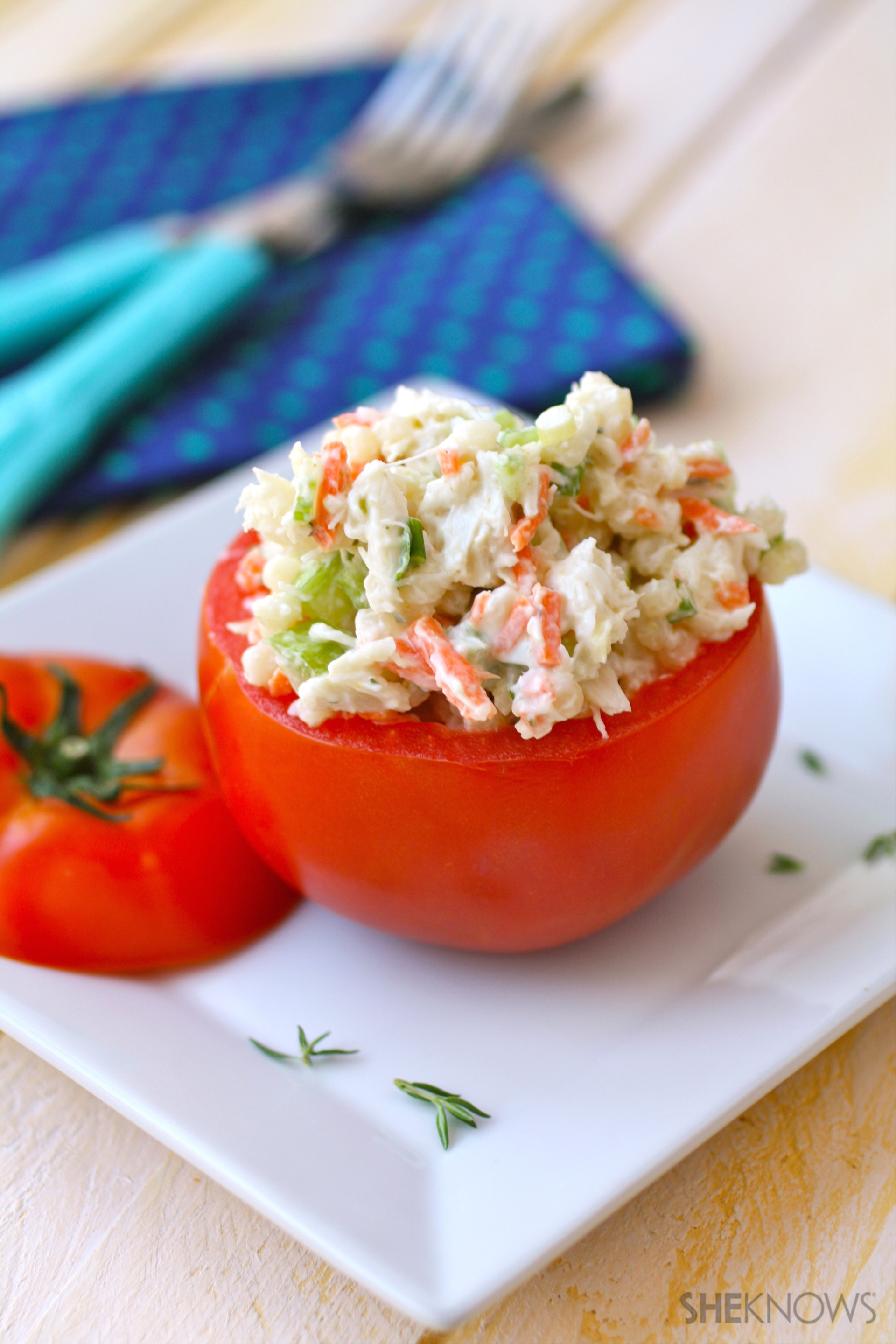 Crab and couscous stuffed tomato salad