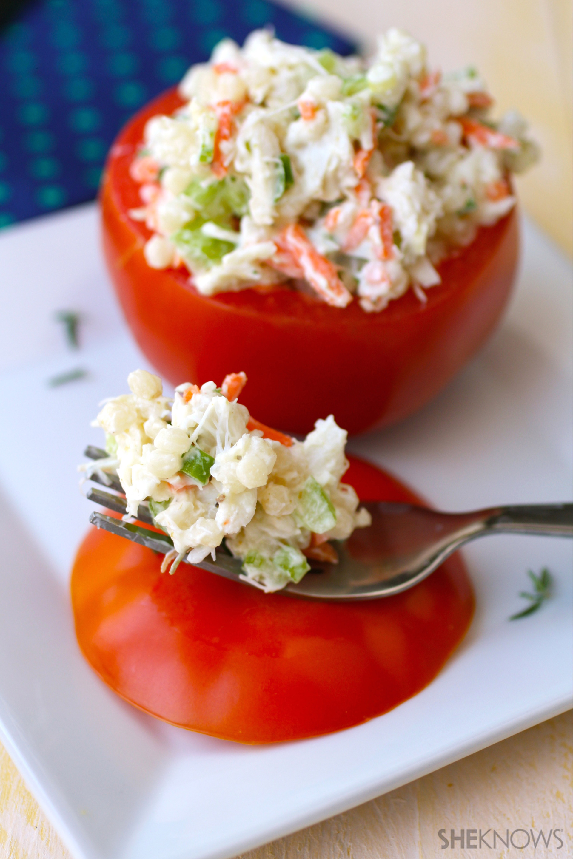 Crab and couscous stuffed tomato salad