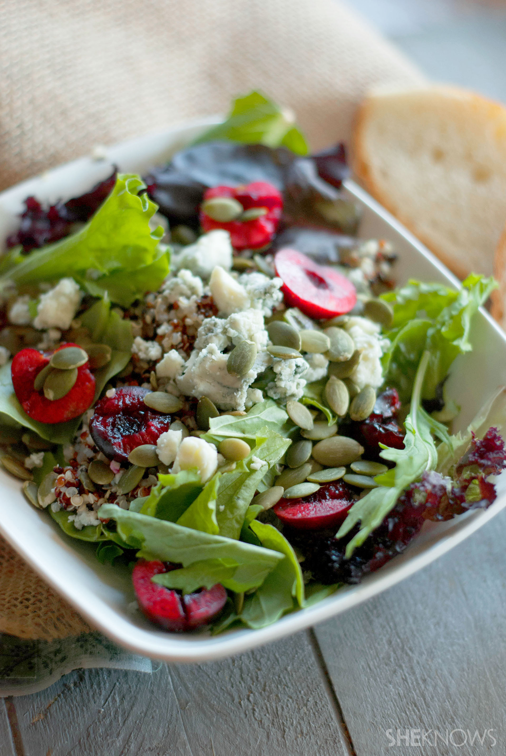 Fresh cherry quinoa salad with pumpkin seeds and dressing is a hearty, healthy meal