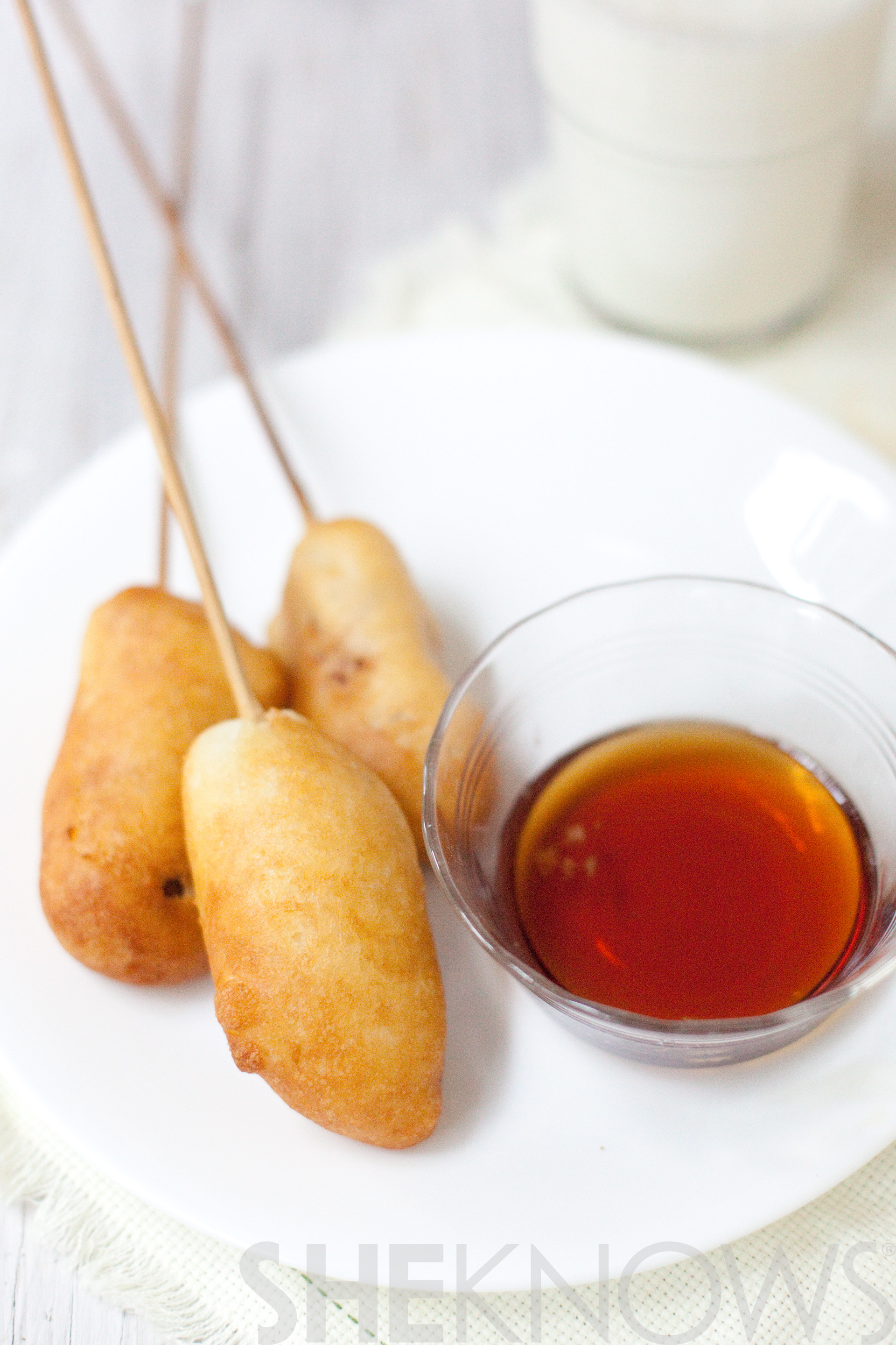 Pancakes on a stick with a bacon and sausage surprise inside