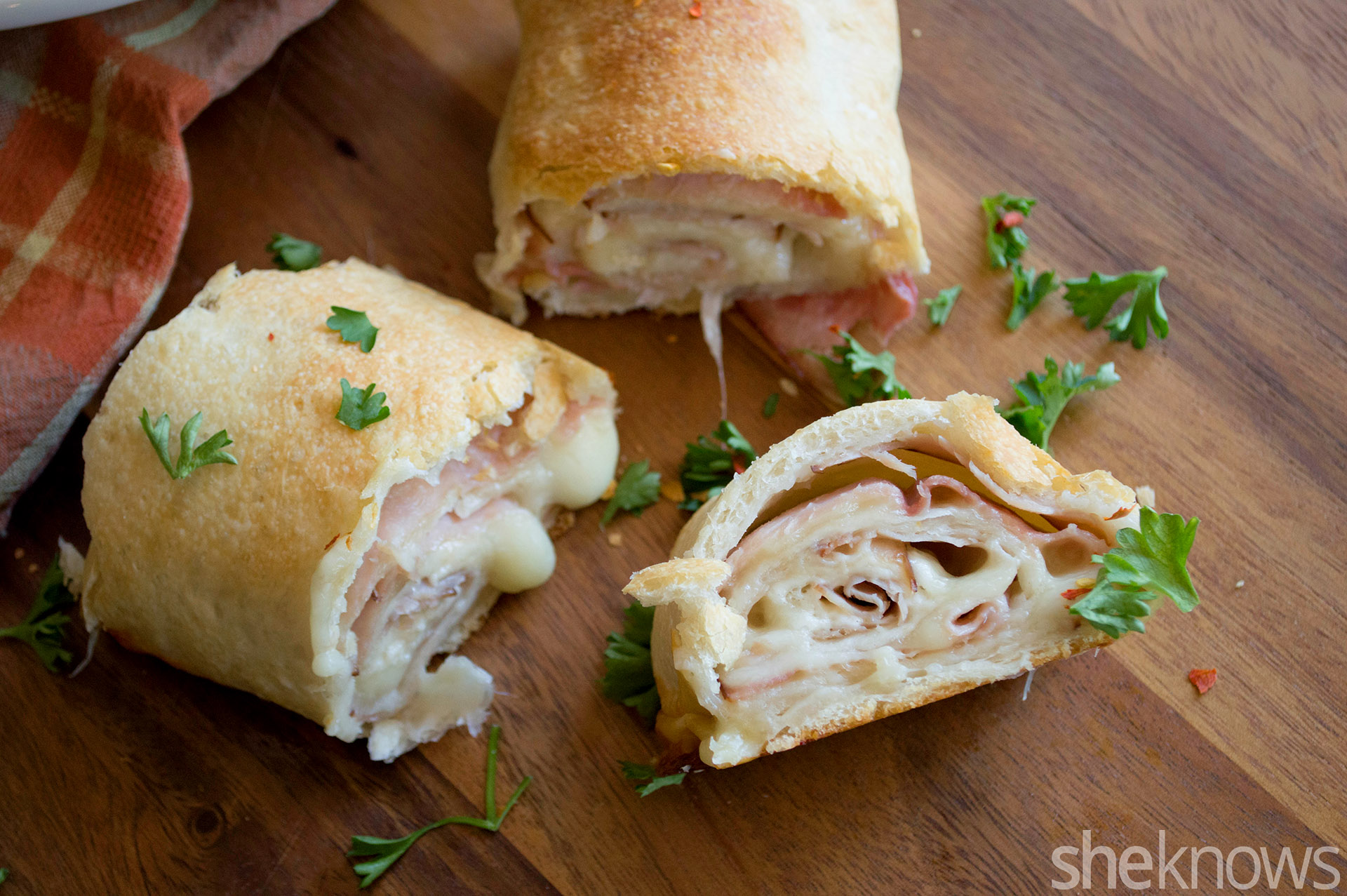 Baked ham and Swiss cheese rolls are a snack kids will love