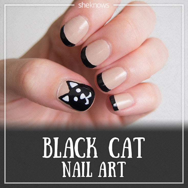 Black cat nails that give the french mani a cute twist