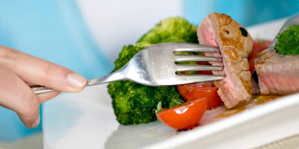 Woman Eating Steak