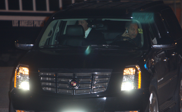 Chris Brown (in back left seat) leaves the LAPD