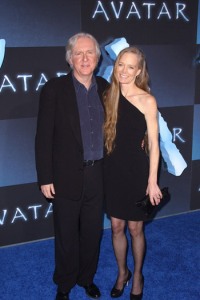 James Cameron and his wife walk the Avatar blue carpet