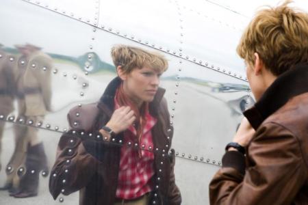 Hilary Swank as Amelia checks herself pre-flight