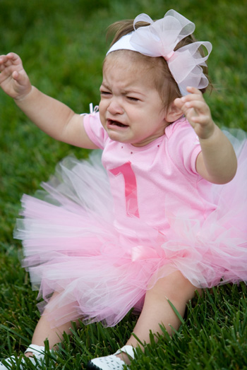 girl crying in corner. Baby girl crying on her first