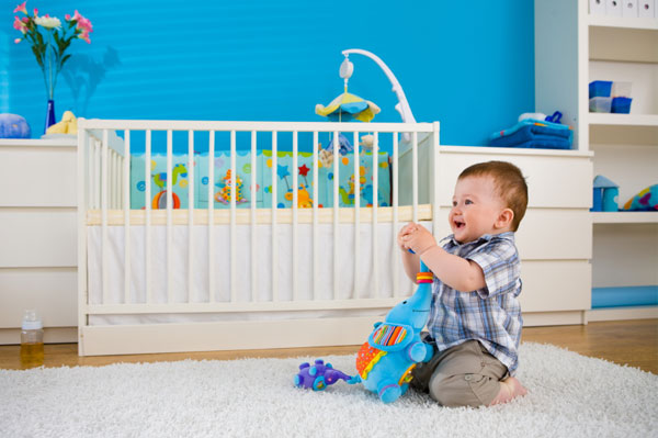 Baby with Toy and Crib