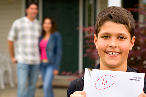 Boy with Graded Paper