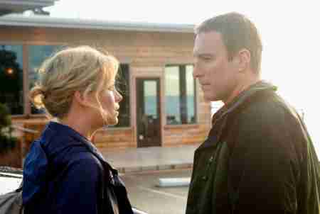 Theron and John Corbett in The Burning Plain