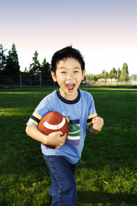 Child playing football