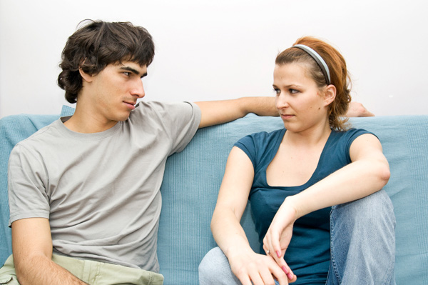 Couple arguing on couch