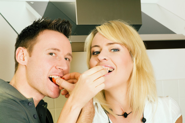 Couple eating strawberries
