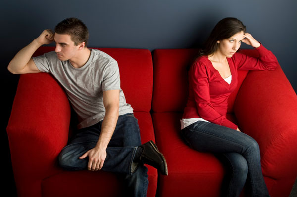 Couple fighting on couch