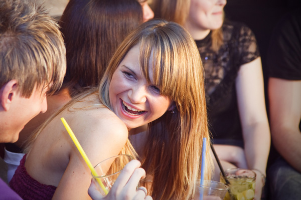 Couple flirting in group setting