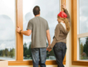 Couple Looking Out Window