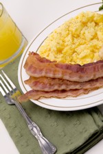 Scrambled eggs and bacon breakfast