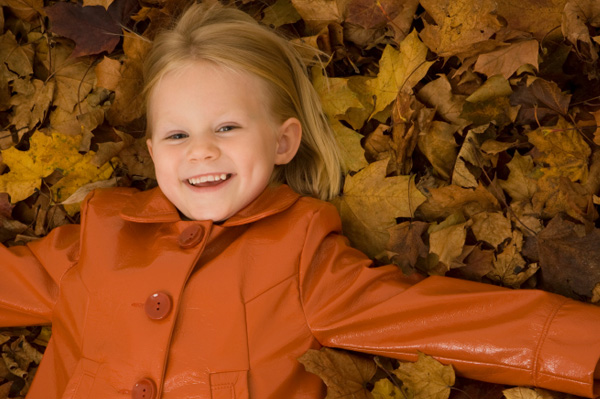 Little Girl in Leaves