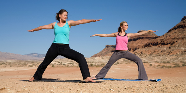 Two woman in yoga pose.