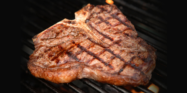 Steaks On Grill. T-Bone Steak on Grill