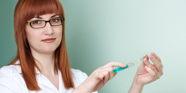 female doctor with syringe for vaccine