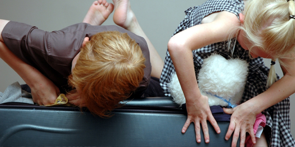 Kids Packing Suitcases