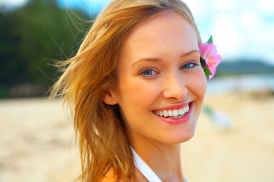 Woman wearing natural summer makeup Though you should ease up on the amount