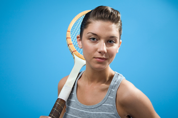Fashionable Young Woman with Tennis Racket