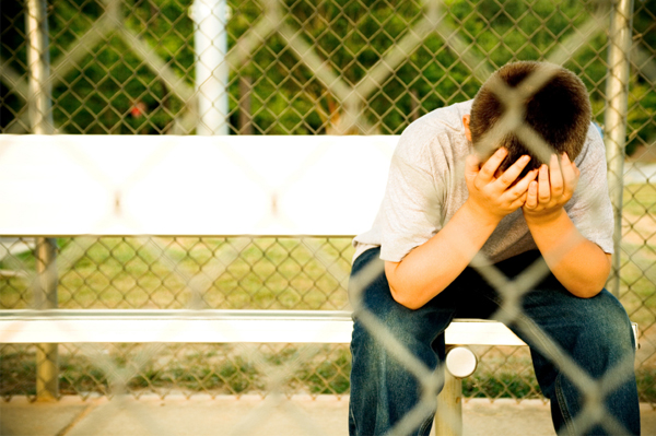 Sad Boy on Bench